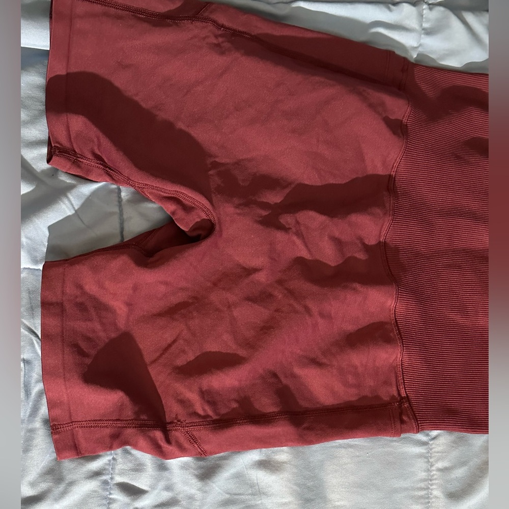 Maroon colored bike shorts from Victoria’s Secret PINK. Has pockets